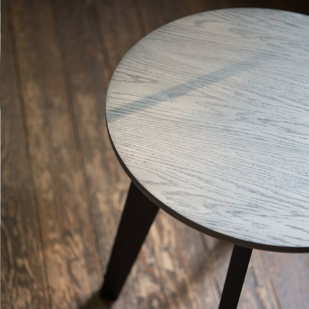 a square close-up image of the 1003-10 drinks table on hardwood flooring