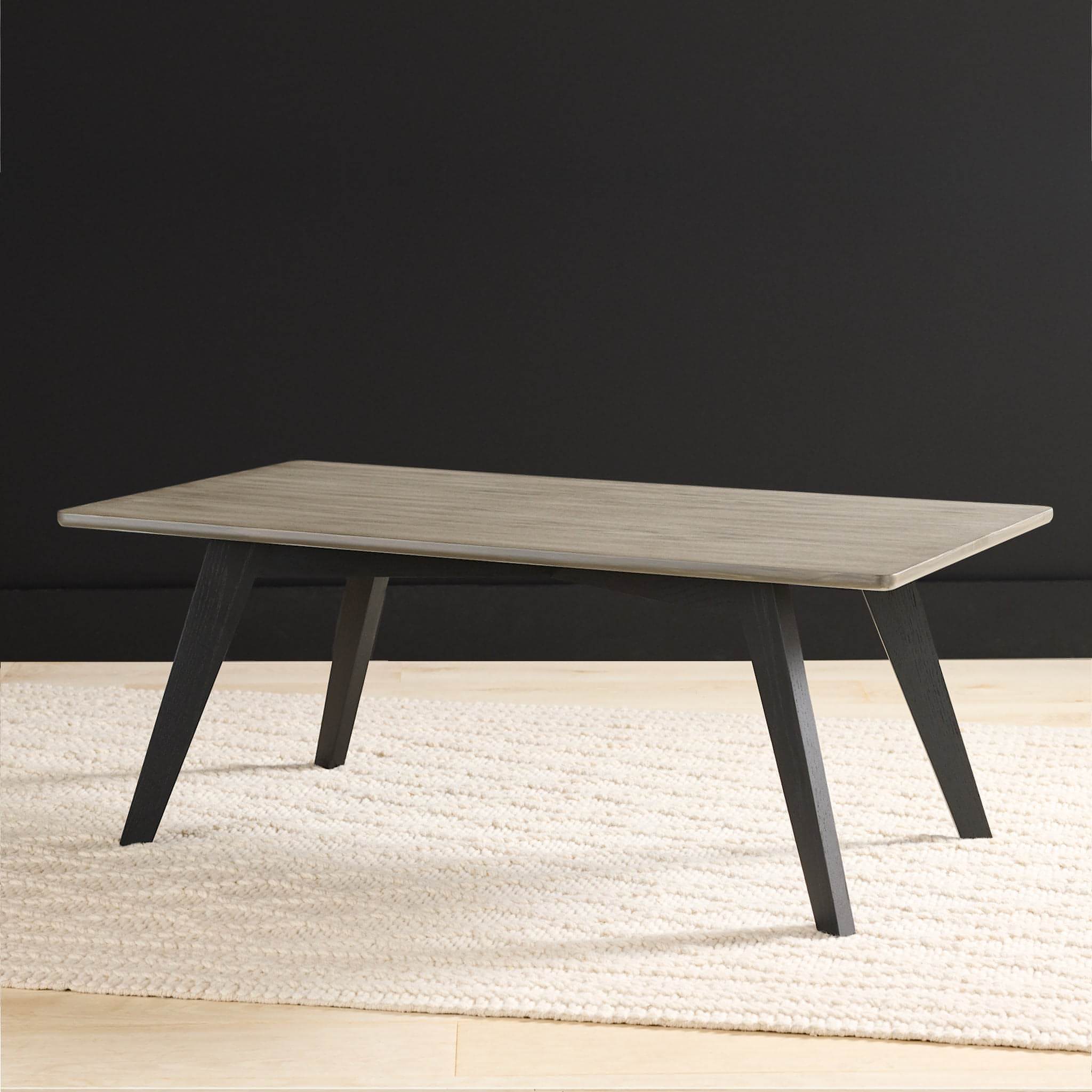 Photo of the Rabbet Home 1003-20 Cocktail Table. Gray oak top with ebonized legs.