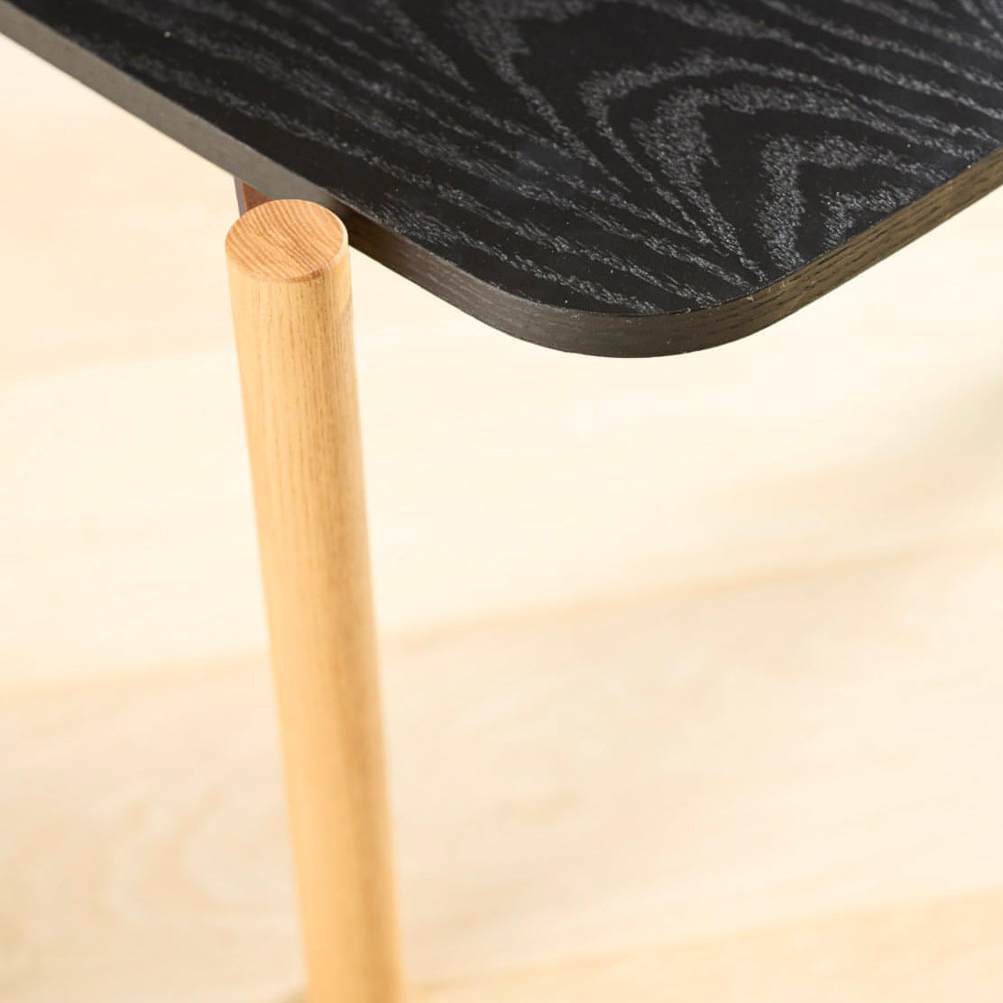 A closeup photo of the Rabbet Home 1009-20 Cocktail Table. 